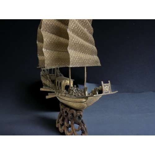 25 - Large Chinese brass model of a junk on the water.