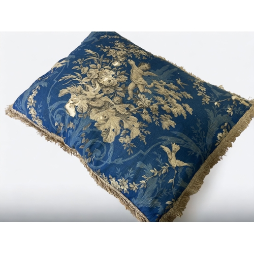 688 - A PAIR OF 19TH CENTURY FRENCH BLOCK PRINTED CUSHIONS.