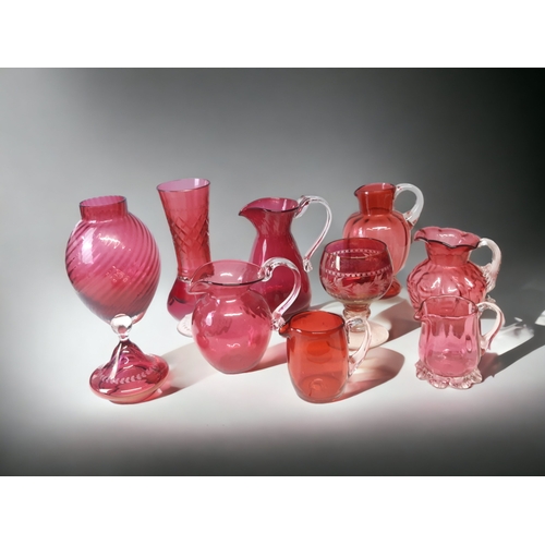 666 - A COLLECTION OF TEN RUBY & CRANBERRY GLASS VASES & JUGS.