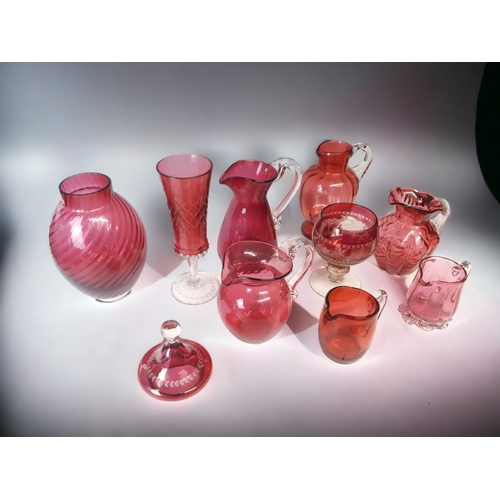 666 - A COLLECTION OF TEN RUBY & CRANBERRY GLASS VASES & JUGS.