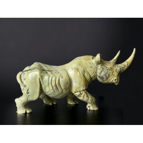 701 - A large pair of Zimbabwean (Shona) people Butterjade Rhinoceros carved sculptures. 
15 x 30cm