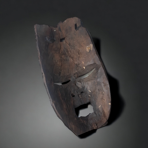 703 - AN AFRICAN CARVED HARDWOOD MASK. POSSIBLY MAKONDE PEOPLE.
1ST HALF 20TH CENTURY.
46CM TALL