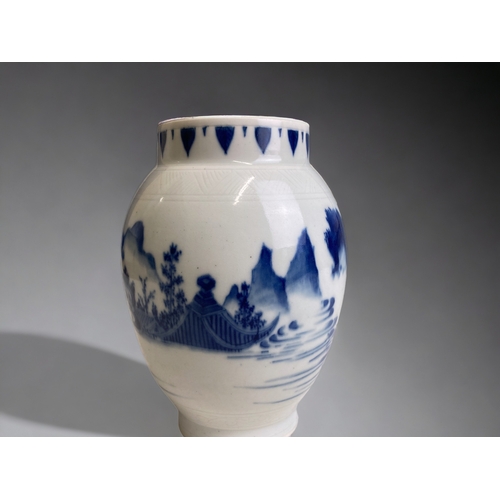 64 - A Chinese blue & white porcelain vase.  Painted seated figure  amongst a seascape. Incised design to... 