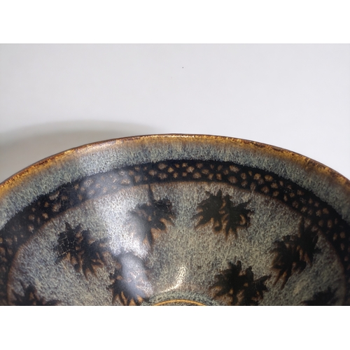 66 - A Chinese Jizhou type 'papercut' bowl.
6.5 x 13.5 cm