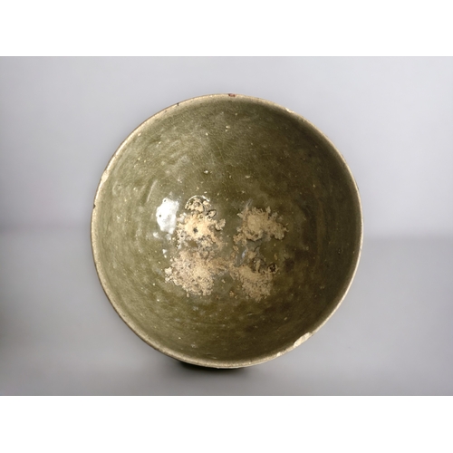 67 - A Chinese Celadon glaze 'Shipwreck' bowl.
Ming dynasty. Incised decoration.
7 x 13 cm