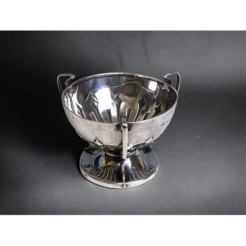 729 - A James Dixon Arts & Crafts style sterling Silver three handle pedestal bowl. Sheffield 1906.
Height... 