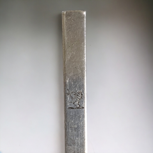 766 - An unusual early style Britannia standard silver two-pronged fork. With engraved family crests. 
17.... 