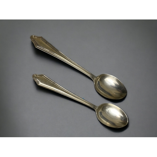 764 - An 1859 silver 'ball handle' spoon by Barker brothers, together with a Dutch 800 silver souvenir spo... 