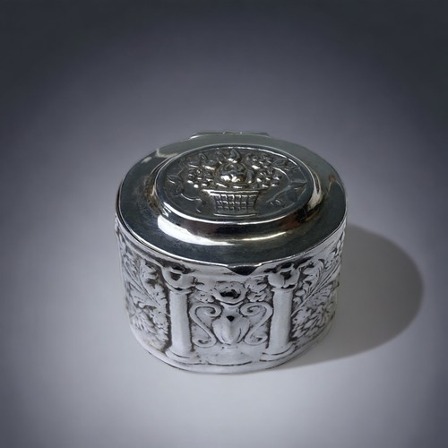 734 - 925 silver snuff box in an oval caddy design set with decorations to lid and sides