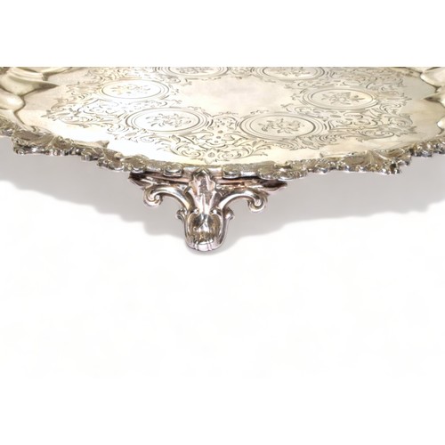 751 - Silver H/M 3 leg salver with embossed decoration standing on scrolled feet 23cm diameter 333g