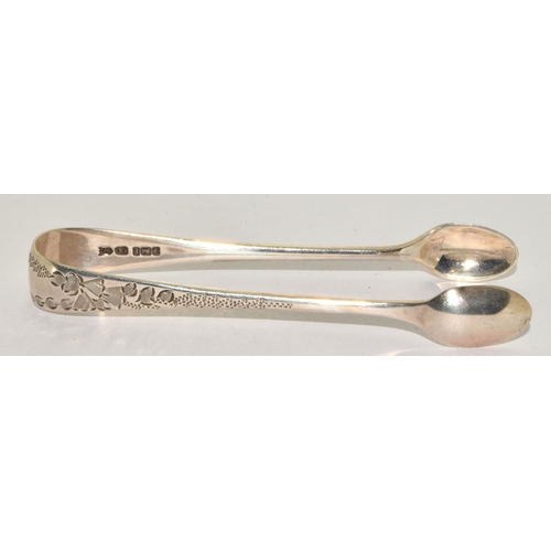 749 - Silver wish bone sprung hinged sugar nips together with a silver pair of scope nips