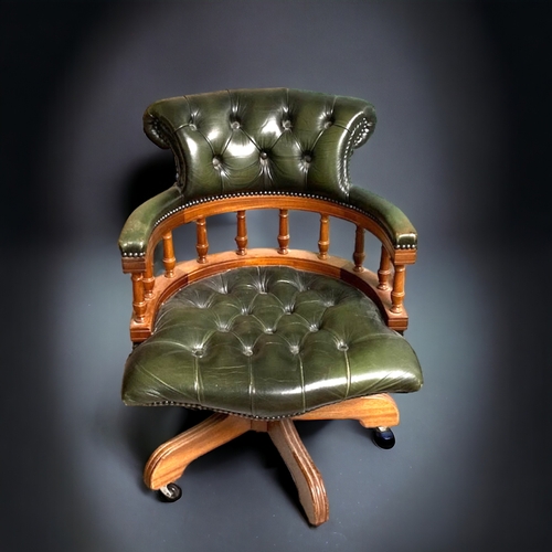 773 - A green leather Chesterfield Captains swivel chair.