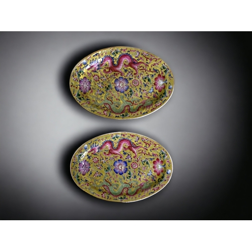 93 - A PAIR OF CHINESE PORCELAIN OVAL DISHES. YELLOW GROUND, WITH ENAMELS PAINTED IN FAMILLE ROSE PALETTE... 