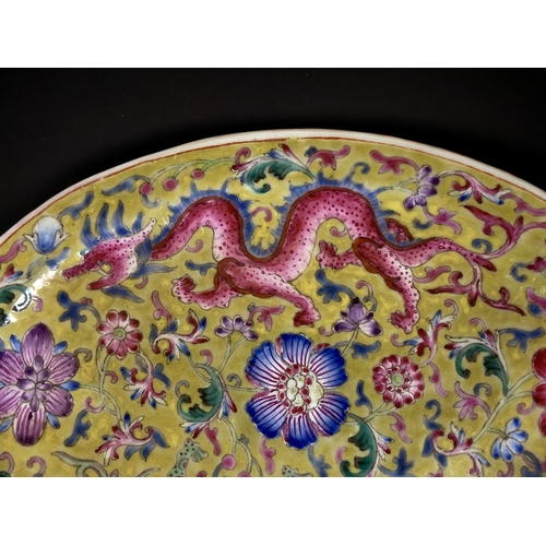 93 - A PAIR OF CHINESE PORCELAIN OVAL DISHES. YELLOW GROUND, WITH ENAMELS PAINTED IN FAMILLE ROSE PALETTE... 