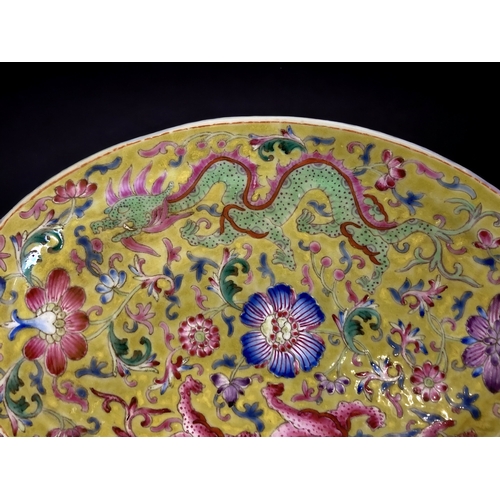 93 - A PAIR OF CHINESE PORCELAIN OVAL DISHES. YELLOW GROUND, WITH ENAMELS PAINTED IN FAMILLE ROSE PALETTE... 