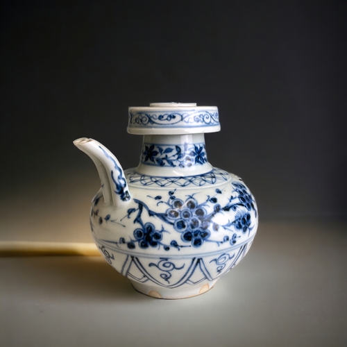 81 - A CHINESE PORCELAIN EWER.
Yuan dynasty. Stylised with twin spout & a lobster handle in high relief.
... 