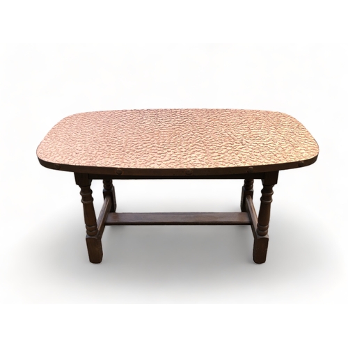 126 - A RETRO COPPER MOUNTED COFFEE TABLE.