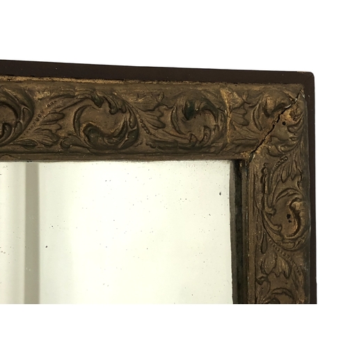 130 - A Gilt plaster wall mirror, together with an Oval wall mirror.