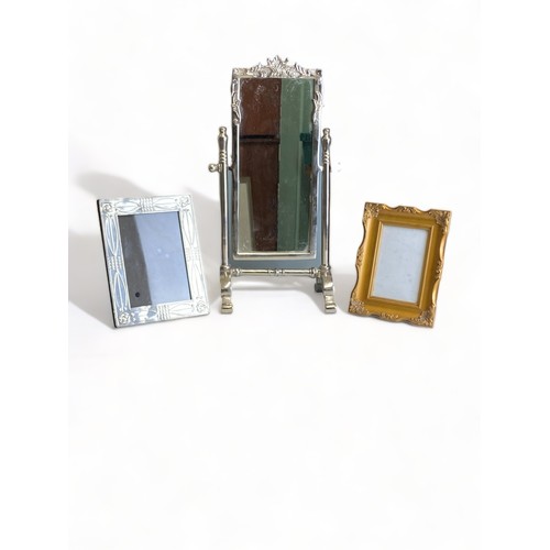 161 - A LARGE METAL DESKTOP MIRROR, AND TWO PICTURE FRAMES