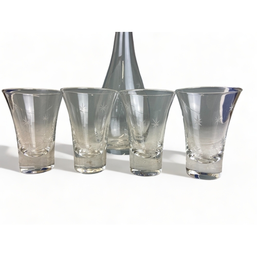 215 - A LIQUEUR DECANTER AND GLASS SET WITH HAND ENGRAVED DESIGN