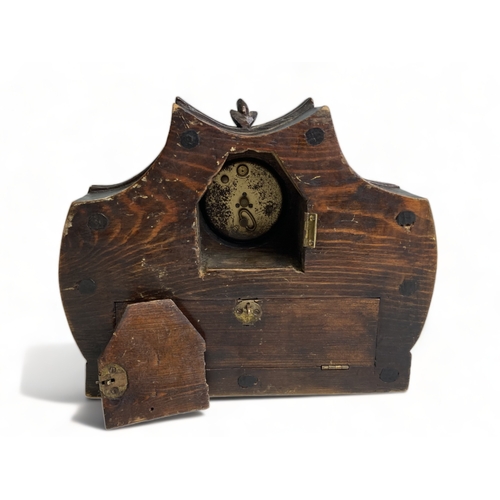 244 - A 19TH CENTURY CARVED OAK BLACK FOREST MANTEL CLOCK. CARVED ACORNS & LEAVES. 
18 X 21CM