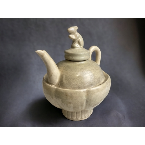 101 - A CHINESE GE-TYPE TEAPOT. WITH RAT KNOP. CREAM CRACKLE GROUND.
HEIGHT - 17CM