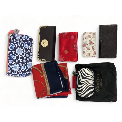 328 - A collection of ladies fashion purses & a scarf.