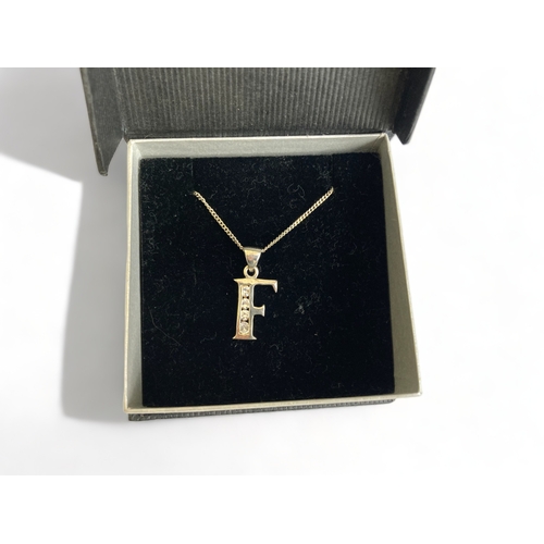 347 - Boxed silver and paste initial letter 'F' necklace