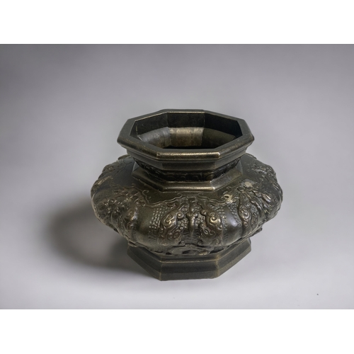 84 - A CHINESE QING DYNASTY BRONZE OCTAGONAL CENSER. 
10 X 14CM