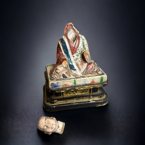 90 - A CHINESE CARVED WOOD POLYCHROME FIGURE OF BUDDHISTIC MONK. 
QING DYNASTY. 
ON BLACK & GILT BASE. WI... 