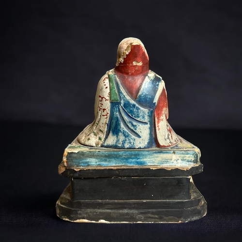 90 - A CHINESE CARVED WOOD POLYCHROME FIGURE OF BUDDHISTIC MONK. 
QING DYNASTY. 
ON BLACK & GILT BASE. WI... 