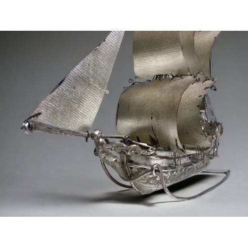 779 - A DUTCH SILVER MINIATURE 'NEFF' SAILING BOAT. 
J. VERHOOGT HOORN (1894-1936).
HEIGHT - 20CM
WEIGHT -... 