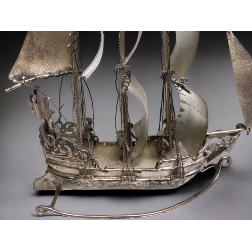 779 - A DUTCH SILVER MINIATURE 'NEFF' SAILING BOAT. 
J. VERHOOGT HOORN (1894-1936).
HEIGHT - 20CM
WEIGHT -... 