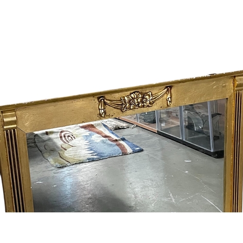 780 - A gilt wood over mantle mirror. 
107 x 65cm