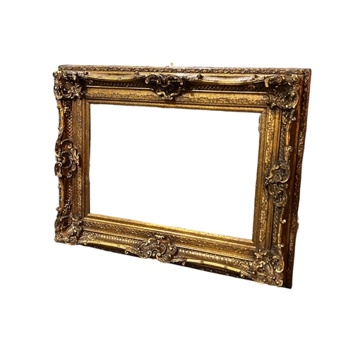 781 - A large Rococo style wall mirror.
20th Century.
130 x 100cm