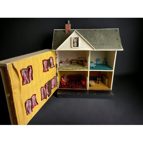 429 - A LARGE VINTAGE DOLLS HOUSE AND FURNISHINGS.