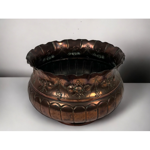 125 - A Victorian William Soutter & sons copper jardinière / planter. Repousse stylised foliate design.