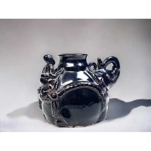 167 - A CHINESE BLACK GLAZE JIZHOU TYPE WATER DROPPER.
Bulbous form 'Elephant' with rider. 
10 x 14.5 cm