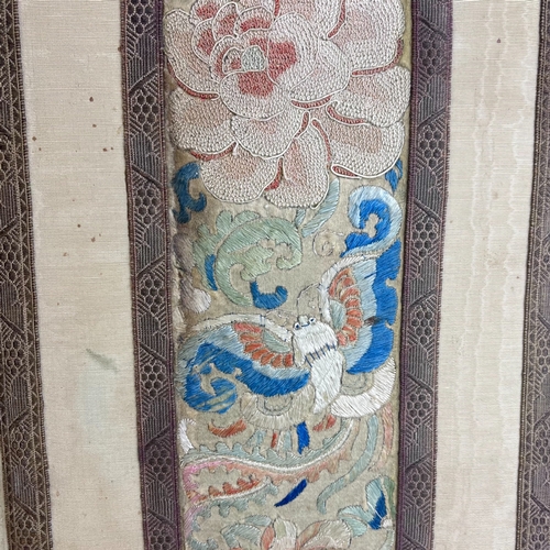 176 - A VINTAGE CHINESE EMBROIDERED SILK WRITING PAD.
Decorated with a Butterfly and Chrysanthemum.