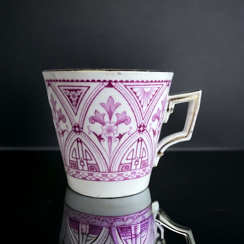 219 - A WILEMAN & CO TEACUP & SAUCER TRIO.
Pink Aesthetic Christopher Dresser style design.
Marks to base.