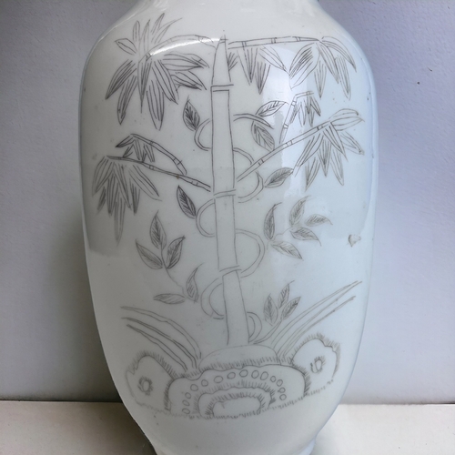 180 - A CHINESE WHITE PORCELAIN BALUSTER VASE. 
Late Qing / Republic period.
Black painted Bamboo outcrop.... 