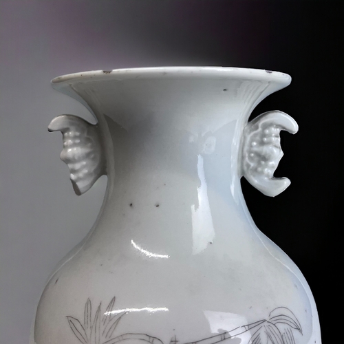 180 - A CHINESE WHITE PORCELAIN BALUSTER VASE. 
Late Qing / Republic period.
Black painted Bamboo outcrop.... 