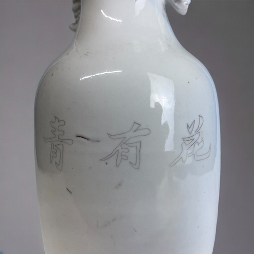 180 - A CHINESE WHITE PORCELAIN BALUSTER VASE. 
Late Qing / Republic period.
Black painted Bamboo outcrop.... 