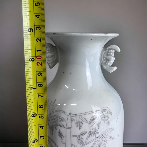 180 - A CHINESE WHITE PORCELAIN BALUSTER VASE. 
Late Qing / Republic period.
Black painted Bamboo outcrop.... 