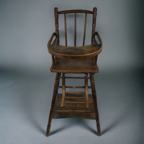 17 - A 19TH CENTURY FRENCH CHILDS CHAIR.
Folds down to walker. With original wheels.