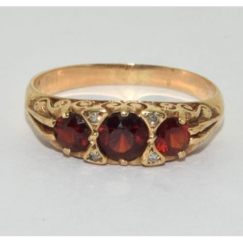 118 - 9ct gold ladies vintage Garnet dress ring size O