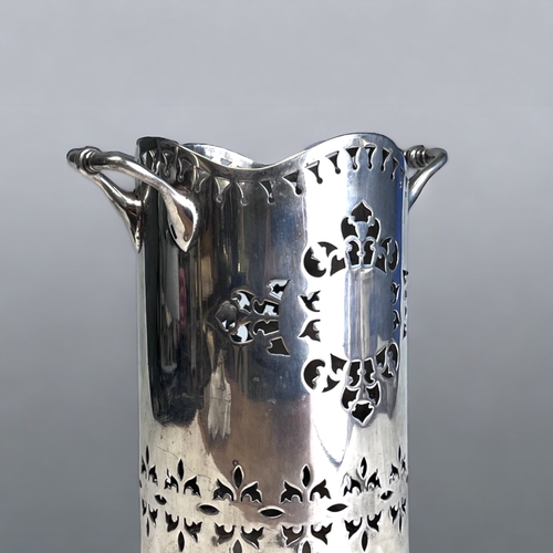 77 - A VICTORIAN SILVER PLATE WINE BOTTLE HOLDER. 
Reticulated stylised design.
Marked to base. 
Height -... 