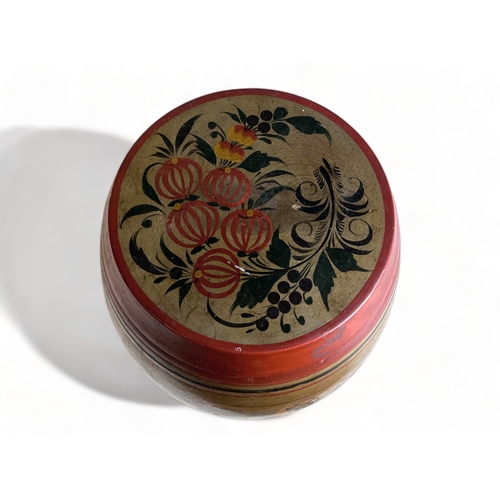 64 - A PAIR OF VINTAGE RUSSIAN KHOKHLOMA TEA CANNISTERS. 
Hand painted foliate designs.
Height - 21cm