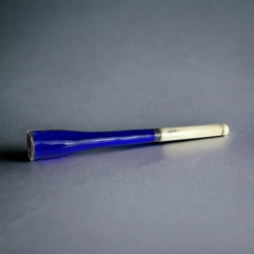 96A - A GUILLOCHE ENAMEL LADIES CHEROOT / CIGARETTE HOLDER. 
With sterling silver collar and bone mouth-pi... 