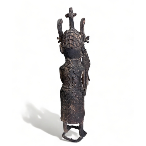 239 - A BENIN BRONZE OBA 'WARRIOR' FIGURE.
Nigeria, 20th century.
Height - 40cm